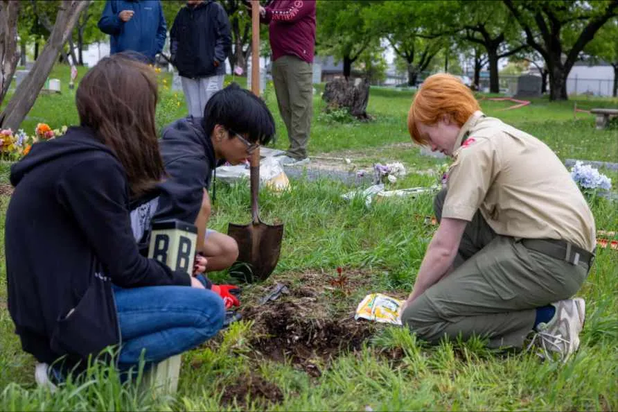 Scouts setting a marker post